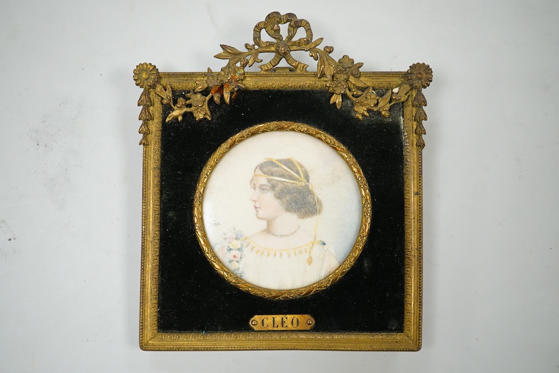 Drea, early 20th century School, Portrait miniature ‘Cleo’, Pre-Raphaelite style, tondo watercolour on ivory, signed, housed in an ornate gilt metal frame, overall 11cm high - CITES Submission reference KB82XPEQ